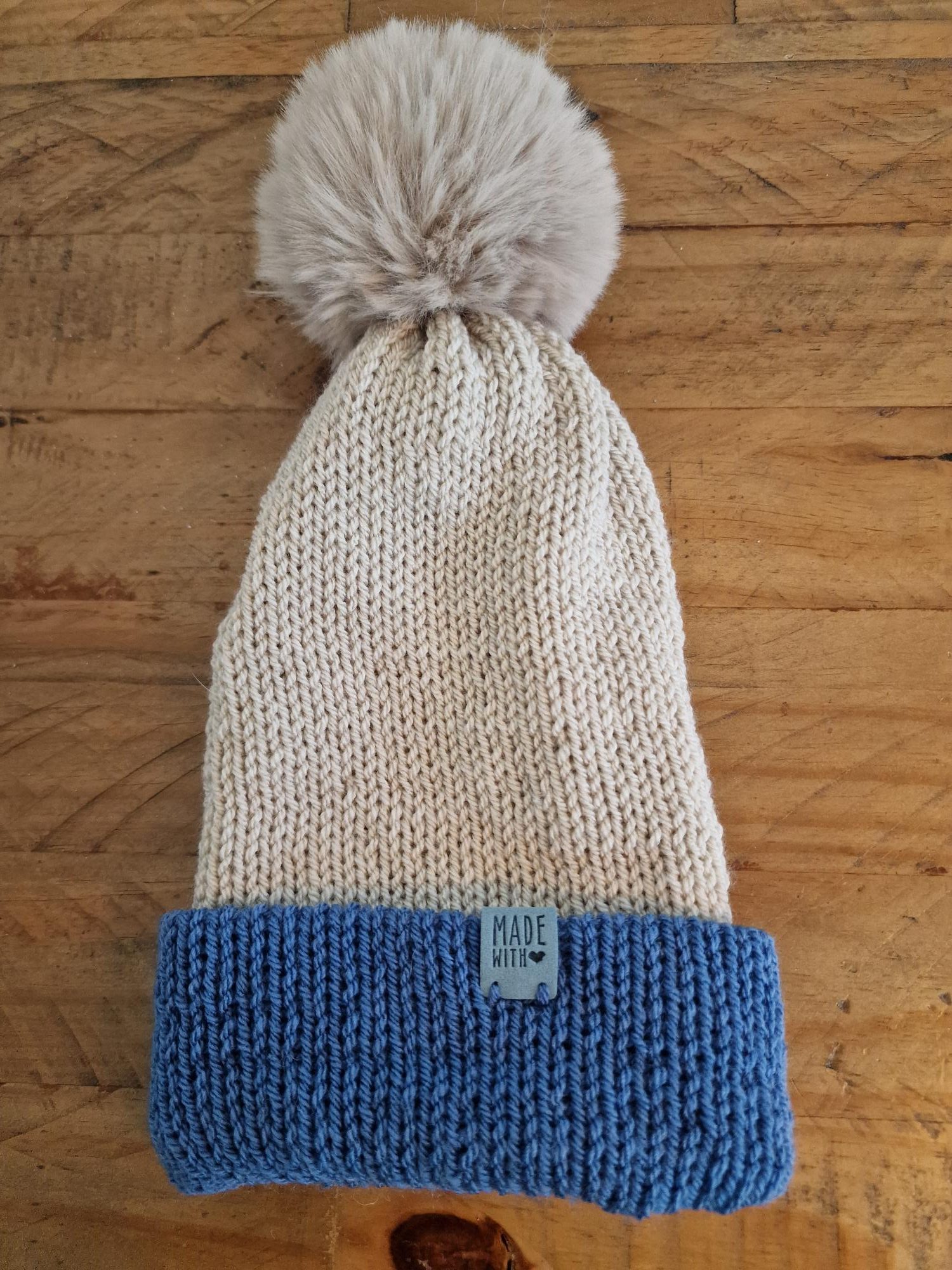 Handmade Light Beige Knitted Bobble Hat with Medium Blue Brim - Image 2